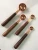 Import New Style  Kitchen Measuring Baking Tools Rose Gold Color 8PCS Measuring Cups And Spoons With Walnut Wood Handle from China