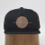 Import Wholesale design your logo flat bill cotton embossed leather patch trucker hat from China