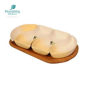Bamboo hotel nut serving tray with white ceramics