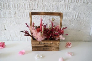 Beautiful real flowers natural dried flowers in a wooden suitcase