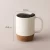 Import Custom Plain Black Porcelain Insulated Cork And Splash Proof Lid Cup Milk Tea Coffee Cork Bottom Ceramic Mug from China