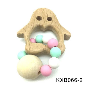 Safe natural beech wood baby teether in animal shaped with food grade silicone bead