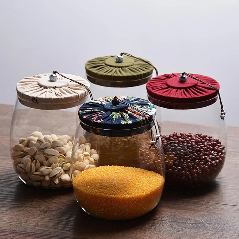 https://img2.tradewheel.com/uploads/images/products/9/7/1000ml-round-glass-food-storage-jars-containers-high-borosilicate-glass-cookies-jars-with-beautiful-cloth-lid-kitchen-canister1-0846381001626877940.jpg.webp