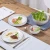 Import Ceramic Dinnerware Round Marbling Glossy Table Mat from China