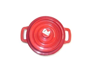 hot red color enameled cast iron baking casserole of heavy duty