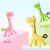 Import Hot sell cut cartoon  baby training teerher giraffe silicone baby teether from China