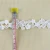 Import Lovely embroidery design small white polyester nigeria guipure lace trim for wedding decoration from China