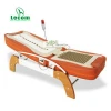Physical therapy bed with tourmaline jades stone