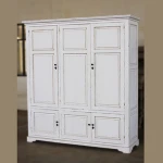 Three door wood wardrobe with clothes rod and shelves