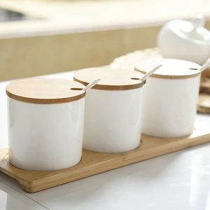 Hot sell White Ceramic Food Storage Jar with bamboo lid and custom logo , Ceramic Food Container for kitchen with spoon