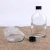 Import 50ml 110ml 200ml clear flat wine glass bottles for brandy with screw top lids from China
