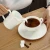 Import factory direct ceramic porcelain new bone china embossed gold rim little pot sugar bowl from China