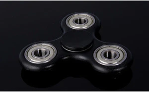 Finger fidget spinner for game play with ceramic bearing
