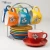 Import High Quality Food Safety Color Glazed Ceramic Tea Cup Set With Stand Ceramic Taza Mug With Rack from Pakistan