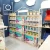 Import SHIJIE newborn baby shopping display stand wooden customized kids clothes groceries store display racks from China
