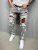 Import Calca mid waist plus size 3XL zipper skinny narrow bottom painted design patches ripped denim pants men jeans trousers from China