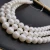 Import Grade AAAA+ 10-11mm big round freshwater pearl chains high quality flawless cultured pearl string round zero scar pearl strand from China