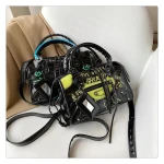 Japanese Graffiti Ins Popular Motorcycle Bag Cute Cartoon Fashion Contrast Color Rivet Messenger Bag Simple Printing Mummy Bag