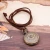 Import LIKA Ancient Genuine Leather Cord Bronze bracelet Rose  embossed Round Pendant Pocket Watch from China