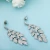 Import LUOTEEMI American CZ Diamond Party Wear Fashion 18k White Gold Leaf Shape Copper Crystal Statement Earrings from China
