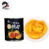Sweet canned yellow peaches fruit in light syrup